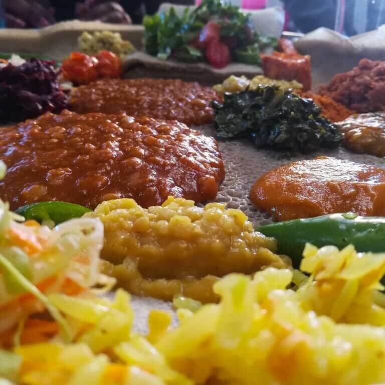 Explore the culinary delights of Ethiopian food in London, featuring a mouthwatering assortment of dishes bursting with flavor.