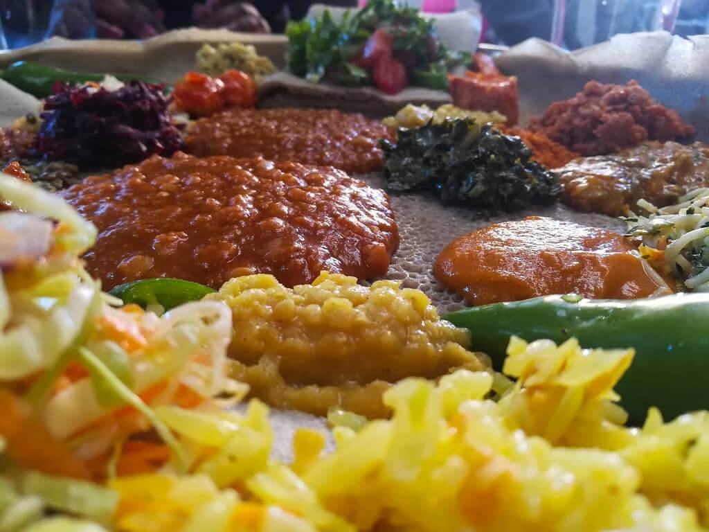 Explore the culinary delights of Ethiopian food in London, featuring a mouthwatering assortment of dishes bursting with flavor.