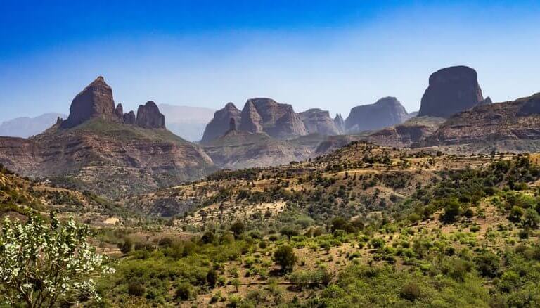 Greenery drapes the peaks of Ethiopia within Simien Mountains National Park.