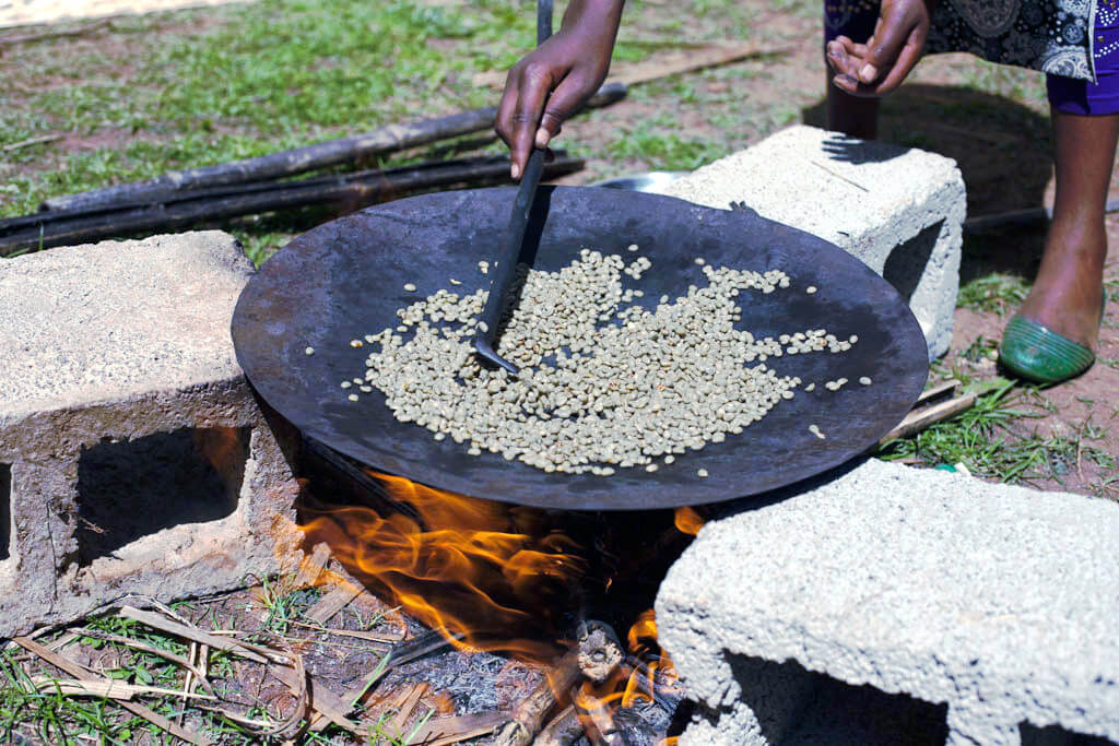 Traditional cooking method with beans and fire.